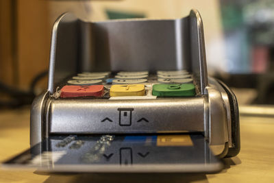 Close-up of credit card reader on table