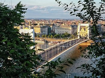 View of bridge in city against sky