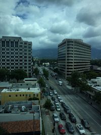 City street against cloudy sky