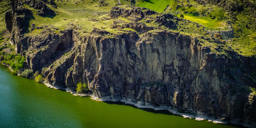 Scenic view of rock formation in lake