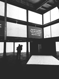 Silhouette men on tiled floor