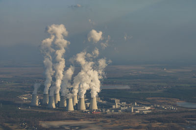 Smoke stacks against clear sky