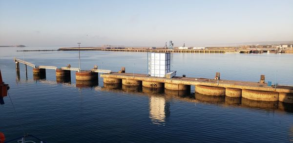 Pier over sea against clear sky