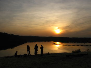 Scenic view of lake at sunset