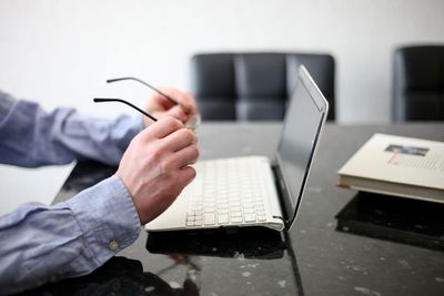 Man using laptop on table