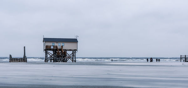 Pile dwelling on the beach of sankt peter-ording in germany.