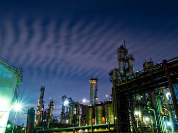 Wavy clouds and factory night view