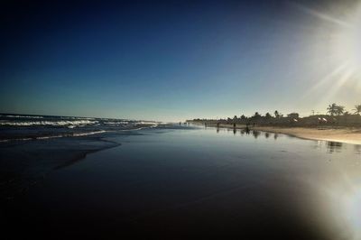 View of beach against clear sky