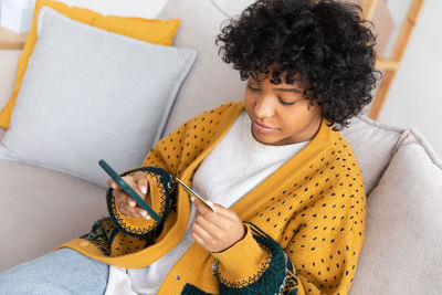 Young woman using phone