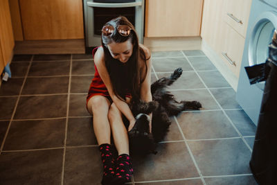 Woman with dog at home