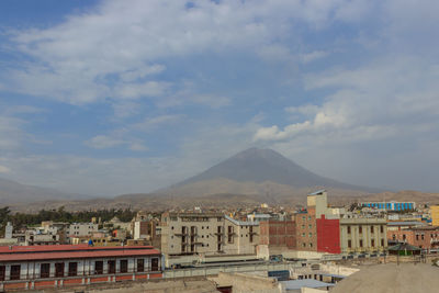 Buildings in city against sky