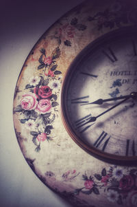 Close-up of clock on wall