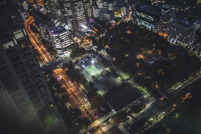 Aerial view of city lit up at night