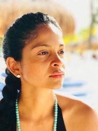 Portrait of young woman looking away