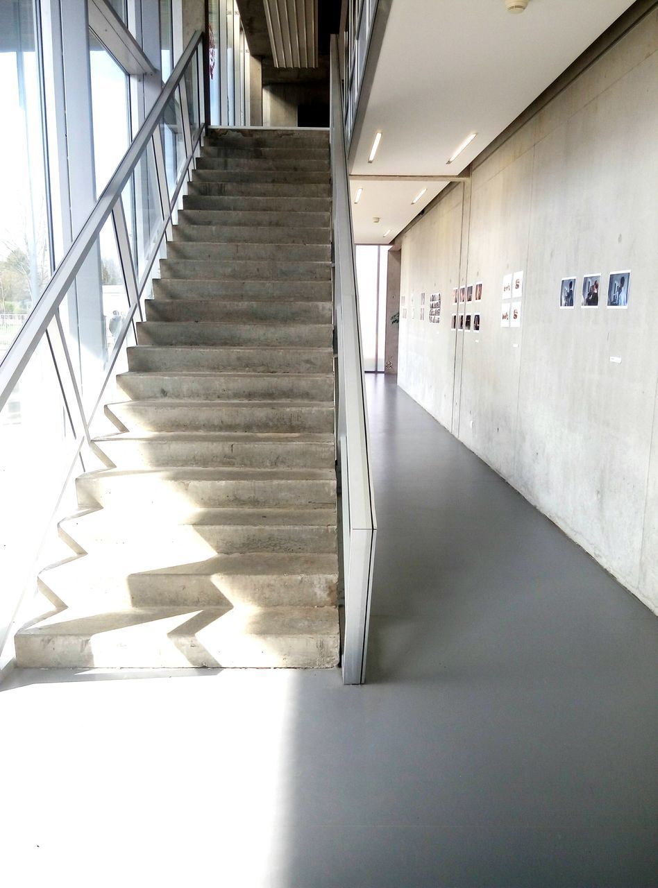 STEPS IN ILLUMINATED UNDERGROUND WALKWAY