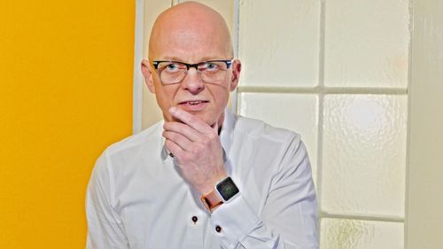 Portrait of man wearing eyeglasses