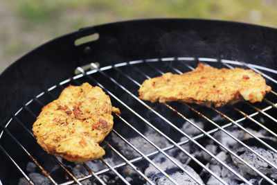 Close-up of meat on barbecue grill