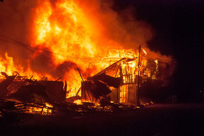 Coffee shop burning at night