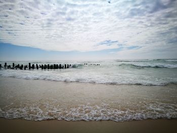 Scenic view of beach against sky