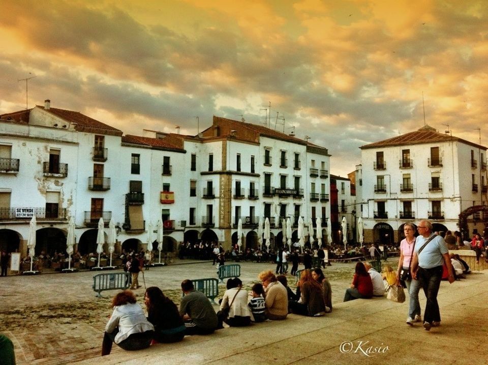 building exterior, architecture, built structure, sky, men, street, person, city, walking, lifestyles, large group of people, city life, cloud - sky, cobblestone, building, leisure activity, residential structure, residential building, cloud