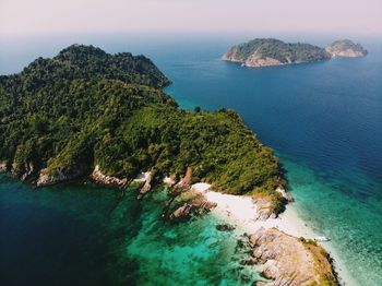 High angle view of rocks on sea shore