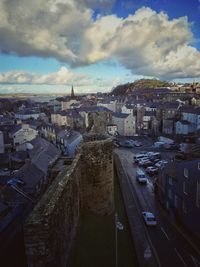 Cityscape against cloudy sky