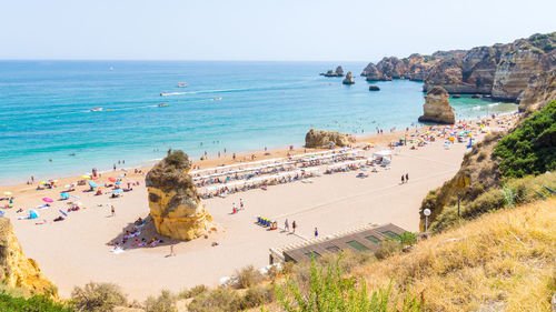 High angle view of tourists at beach