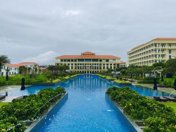 View of swimming pool against buildings