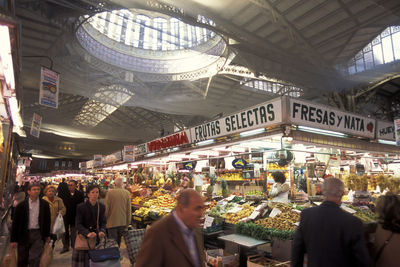 People at market stall in city