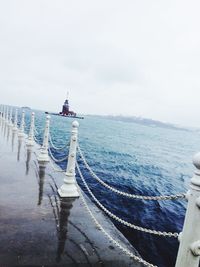 Pier on sea against sky