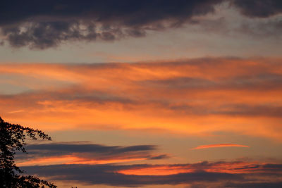 Low angle view of dramatic sky during sunset