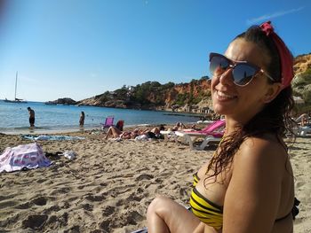 Portrait of smiling woman at beach