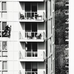 People sitting in balcony of building