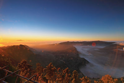 Scenic view of mountain against sky during sunset