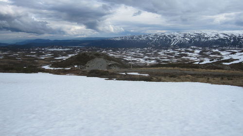 Scenic view of snowcapped mountains against sky