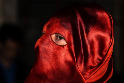 Close-up portrait of woman covering face