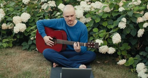 Portrait of man using laptop