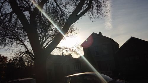 Low angle view of built structure against sky at sunset