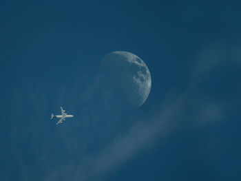 Low angle view of airplane flying in sky