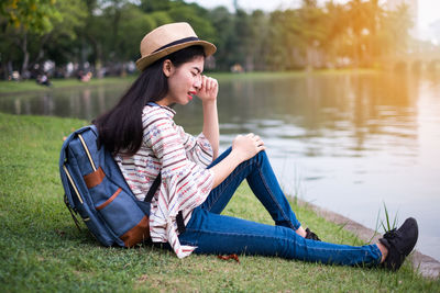 Young woman sitting in lake