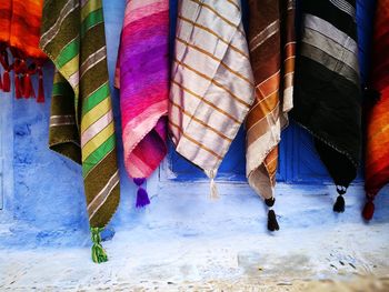 Colorful textiles hanging on wall