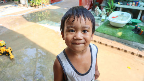 Portrait of cute boy smiling swimming pool