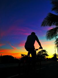 Silhouette of woman at sunset