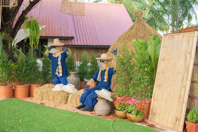 Panoramic view of people outside house