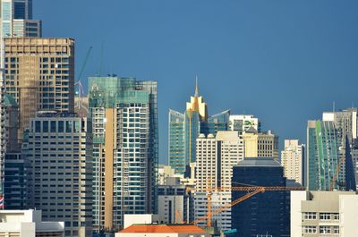 Cityscape against clear sky