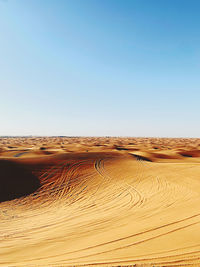 Scenic view of desert against clear sky