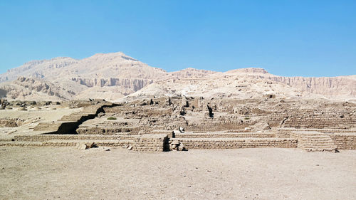 Scenic view of mountains against clear blue sky