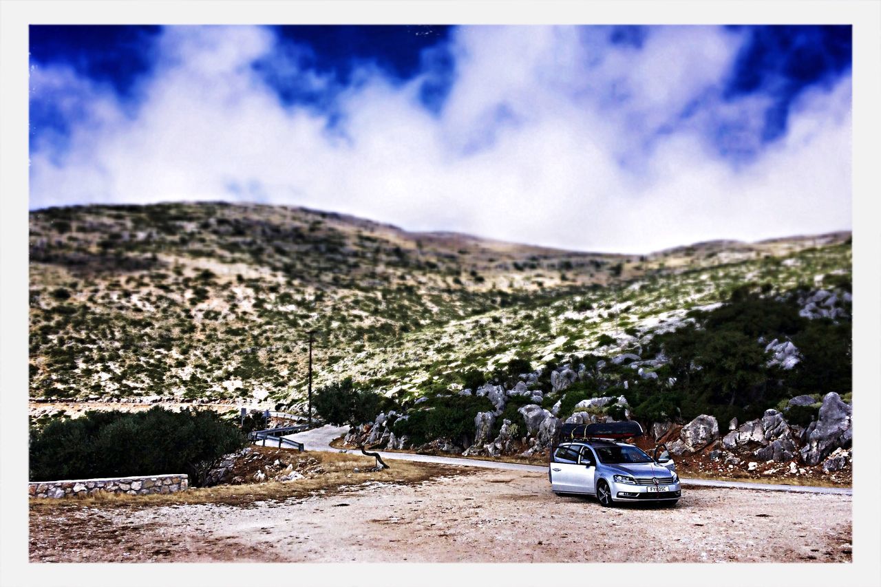 transfer print, auto post production filter, mountain, sky, landscape, cloud - sky, transportation, tree, tranquil scene, tranquility, nature, scenics, cloud, mountain range, day, beauty in nature, car, outdoors, mode of transport, travel