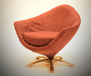 Close-up of hat on table against white background