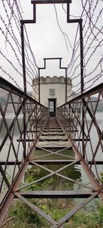 Metal bridge against sky